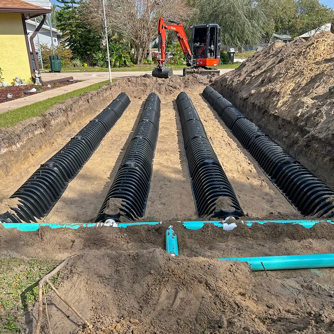 Technician inspecting an aerobic septic system during a home-sale inspection in Comal County, Texas